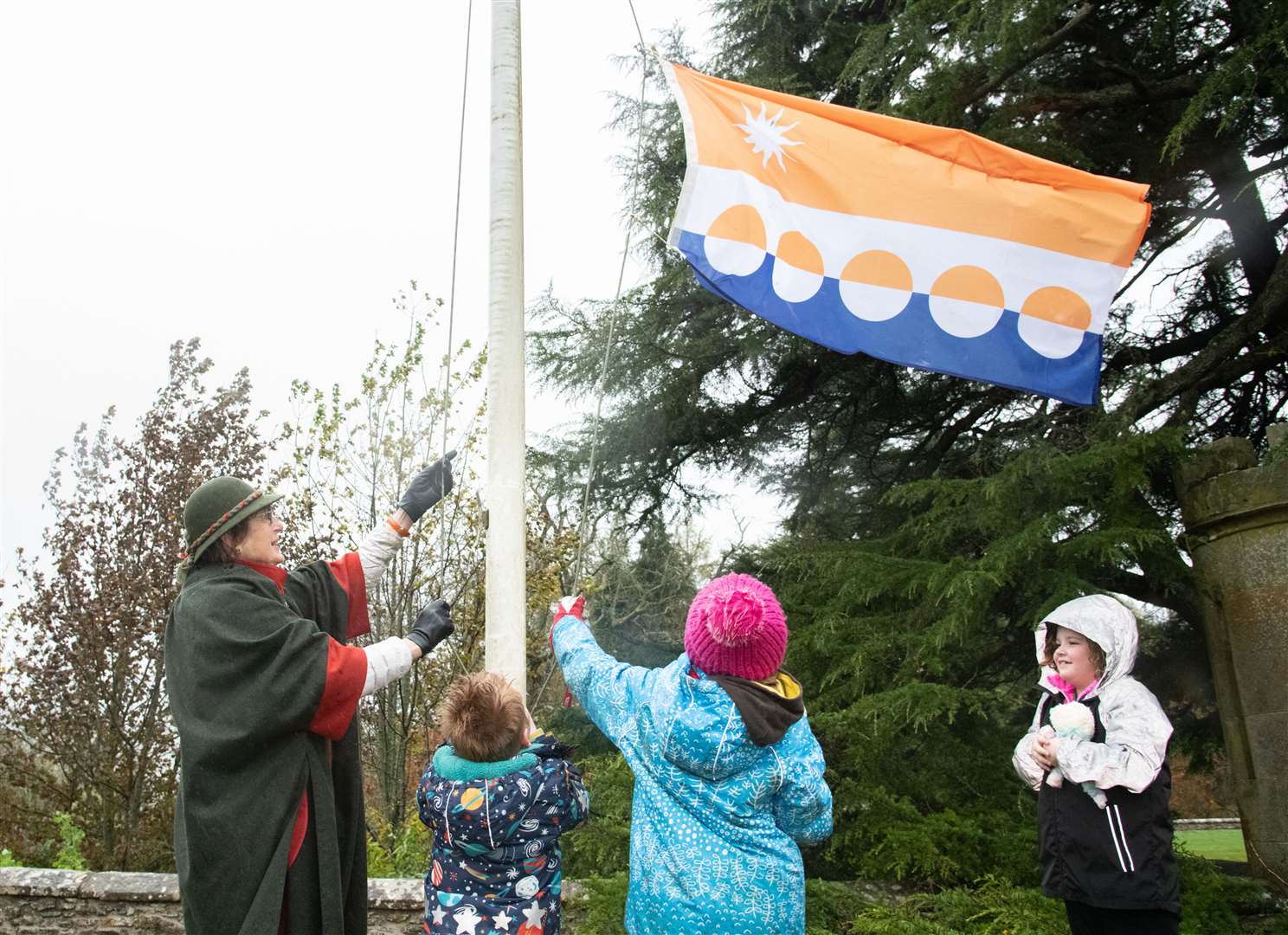 Priscilla Gordon-Duff is given a hand to unveil the Banffshire flag...The Banffshire flag is raised at Drummuir Castle. ..Picture: Daniel Forsyth..