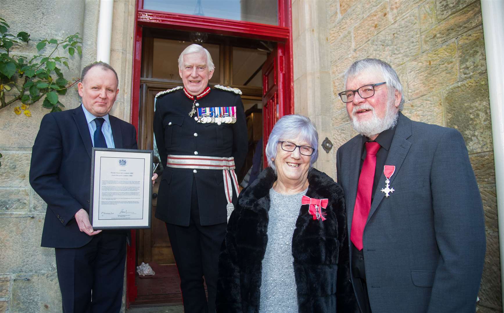 Ronnie and Joyce Loveland, from Mosstodloch, received their MBE medals for Fostering from Lord Lieutenant Seymour Monro and Roddie Burns from Moray Council...Picture: Becky Saunderson..