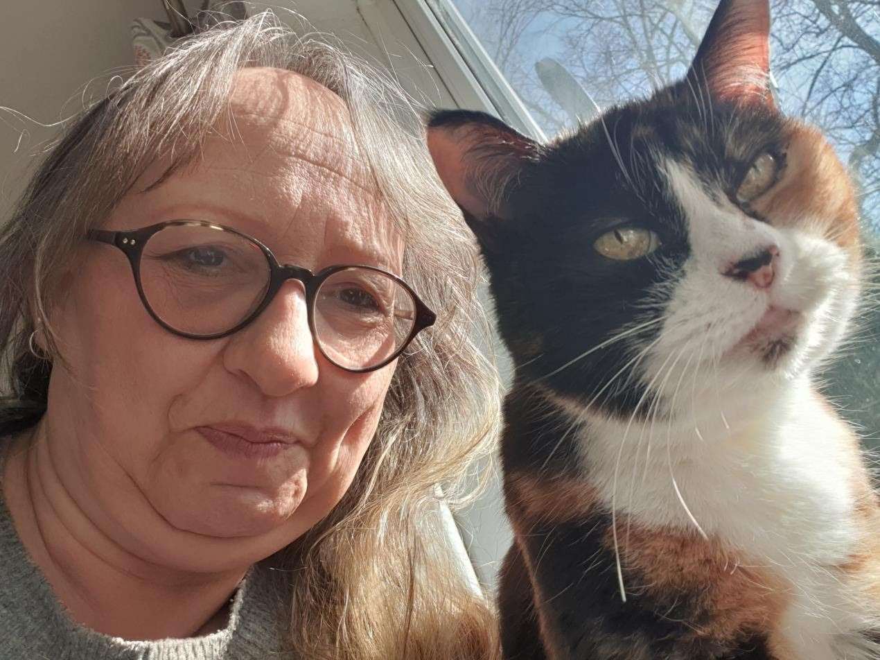 Caroline Sherlock and her cat Susie.