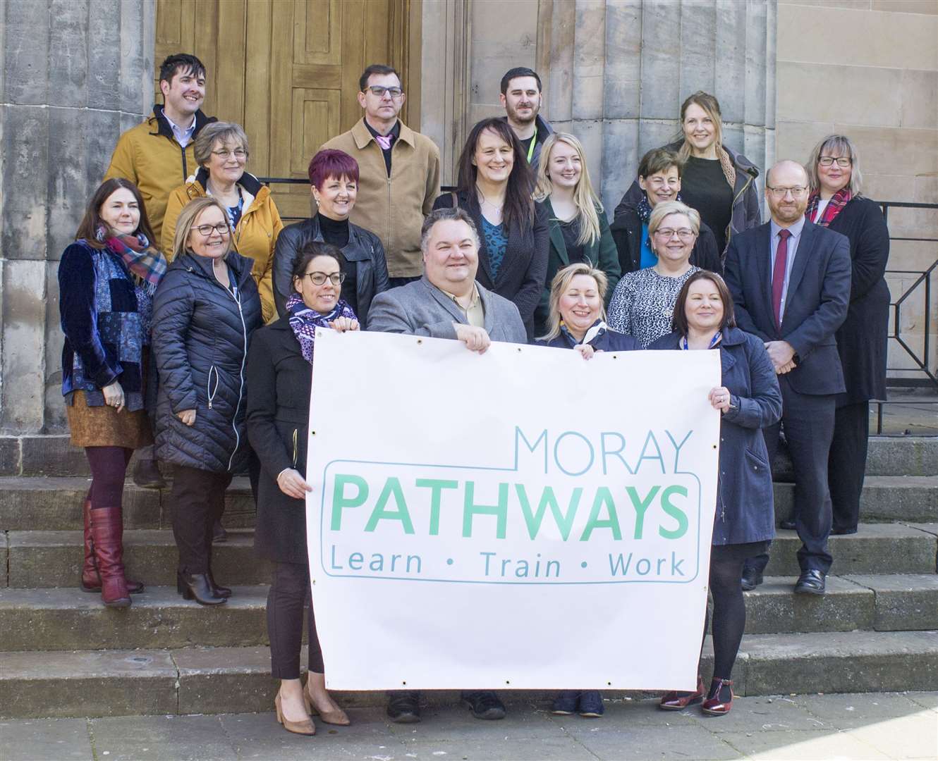 Chairman of the Moray Economic Partnership, Councillor Graham Leadbitter (front, second left) and other members of Moray Pathways, pictured here pre social distancing. Picture: Angus McNicholl