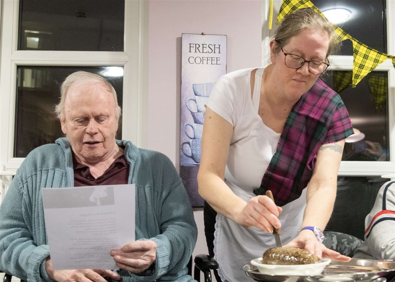 Bill Duff addressing and Katie Hopewell cutting the Haggis...Balhousie Care Home Burns Supper in Huntly...Picture: Beth Taylor.