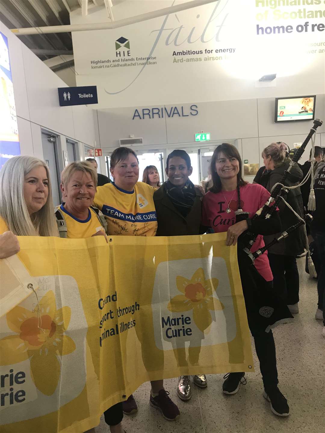 Anne (second left) bumped into the TV presenter Naga Munchetty (second right) as she arrived back at Inverness Airport.