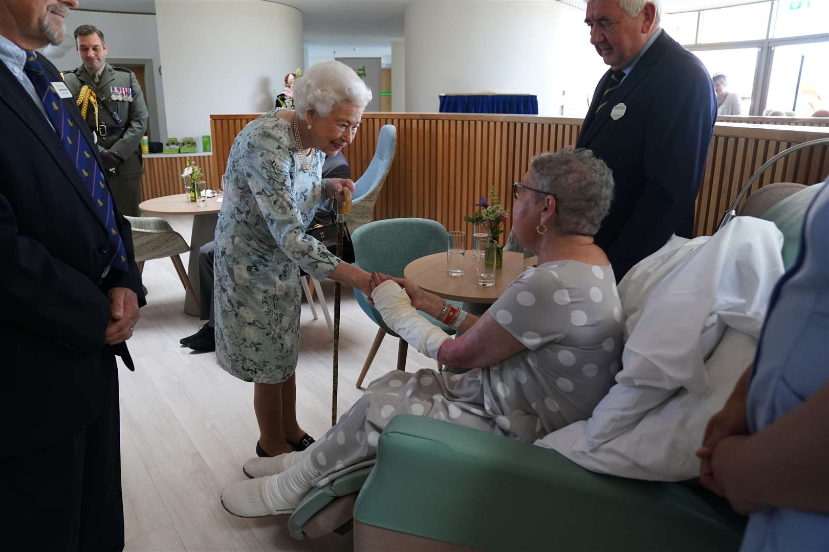 The Queen chatted to cancer patient Pat White, whose husband’s phone rang as they were being introduced (Kirsty O’Connor/PA)