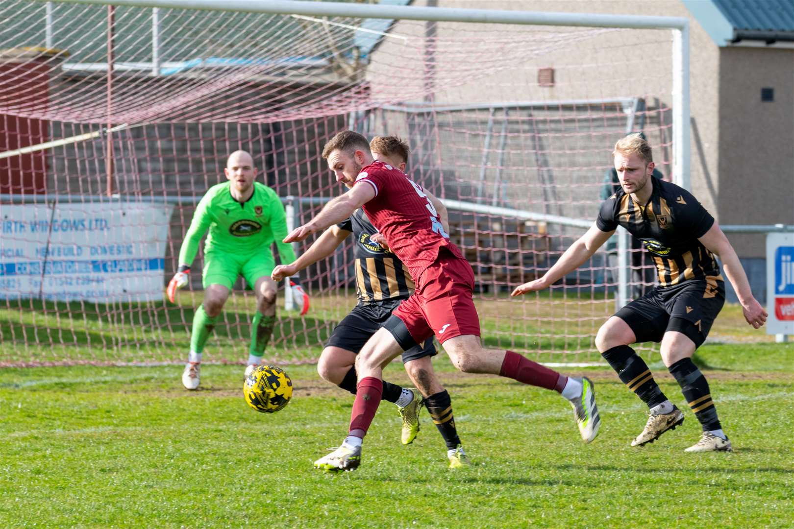 Keith's Ryan Robertson tries to find a shot for goal against Huntly's Ryan Sewell and Ross Still. Keith F.C (1) v Huntly F.C (0) at Kynoch Park, Keith. Highland Football League.Picture: Beth Taylor