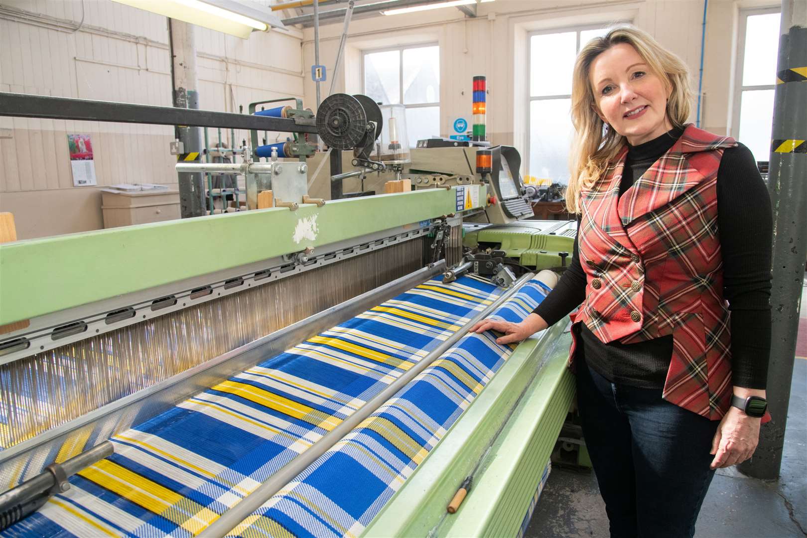 Margo Page as the tartan is being produced at Isla Bank Mills. Picture: Daniel Forsyth