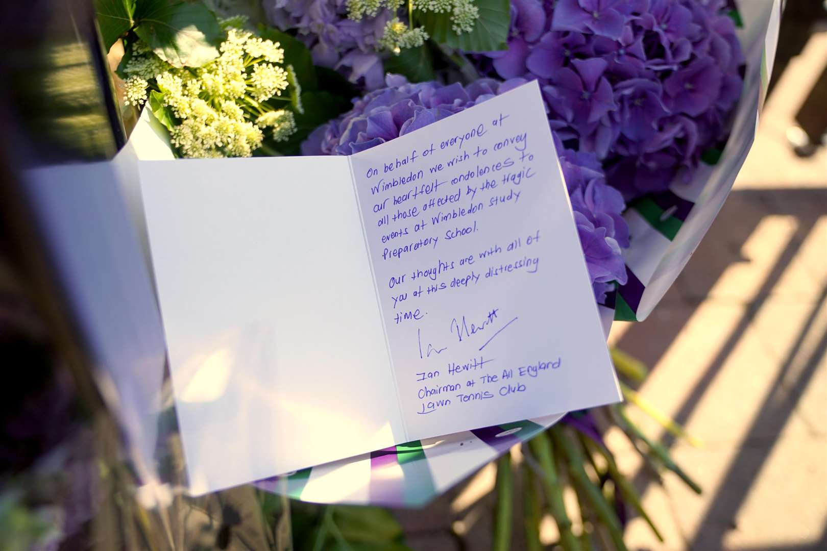Flowers were left by Ian Hewitt, chairman of the All England Lawn Tennis club (Yui Mok/PA)