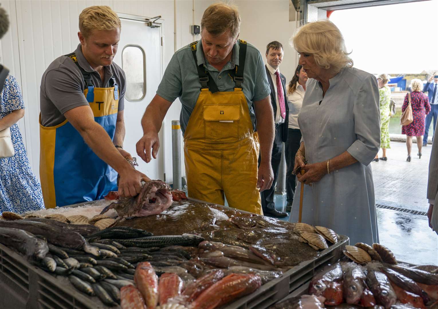 The Duchess of Cornwall talks to fishmongers (Arthur Edwards/The Sun/PA)