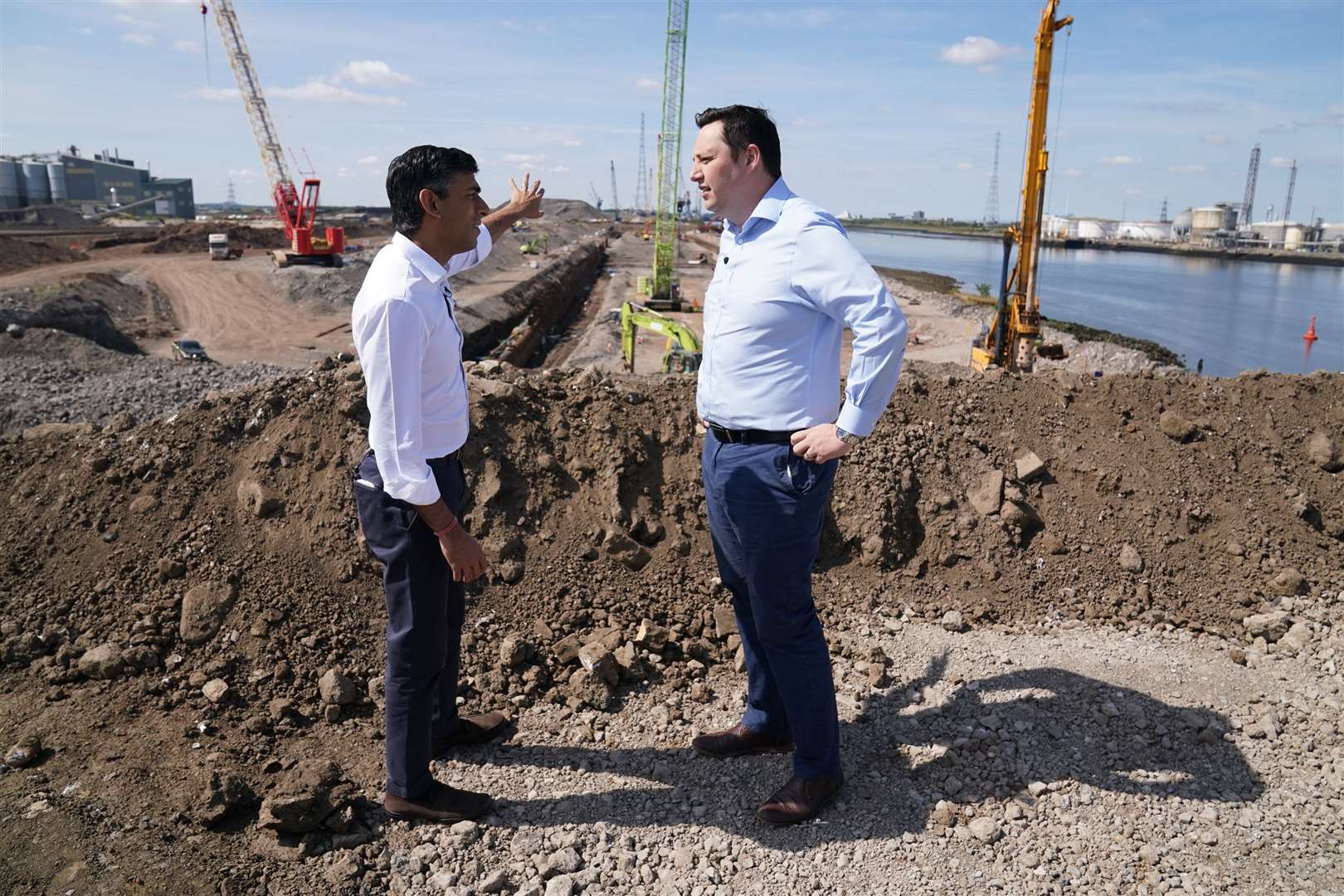 Rishi Sunak (left) speaks with Tees Valley Mayor, Ben Houchen, during a visit to Teesside Freeport, Teesworks, in Redcar (Owen Humphreys/PA)