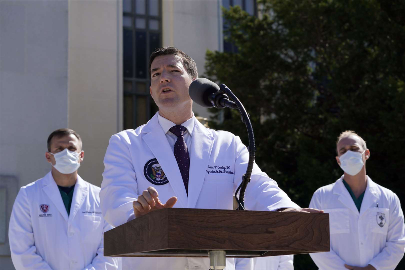 Dr Sean Conley briefs reporters at Walter Reed National Military Medical Centre (Susan Walsh/AP)