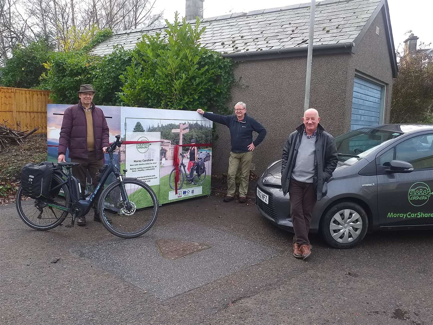 (From left) Gordon McAlpine, of Moray Carshare, Bill Malcolm, of Aberlour Community Association, and Councillor Derek Ross (Speyside Glenlivet) at the launch of Moray Carshare’s new car and e-bike services in Aberlour.