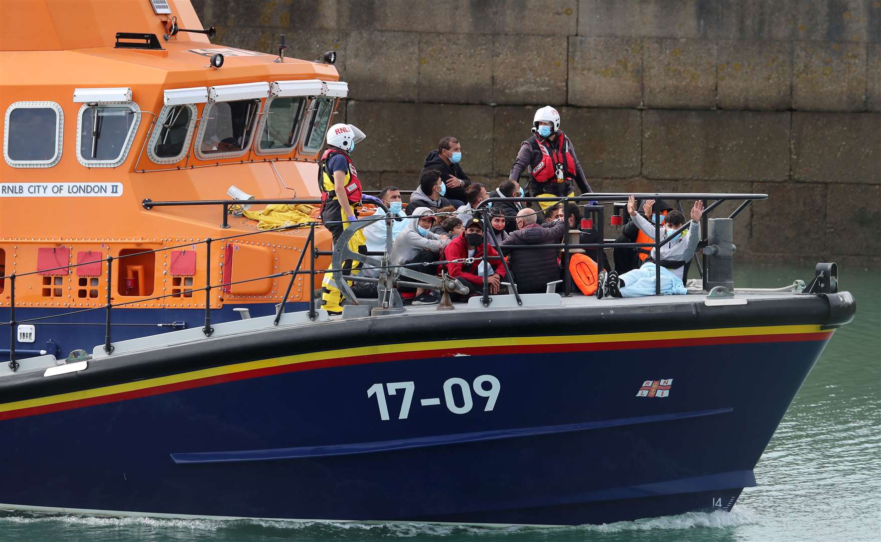 A group of people thought to be migrants are brought into Dover, Kent, onboard the Dover RNLI lifeboat following a number of small boat incidents in the Channel earlier today (Gareth Fuller/PA)