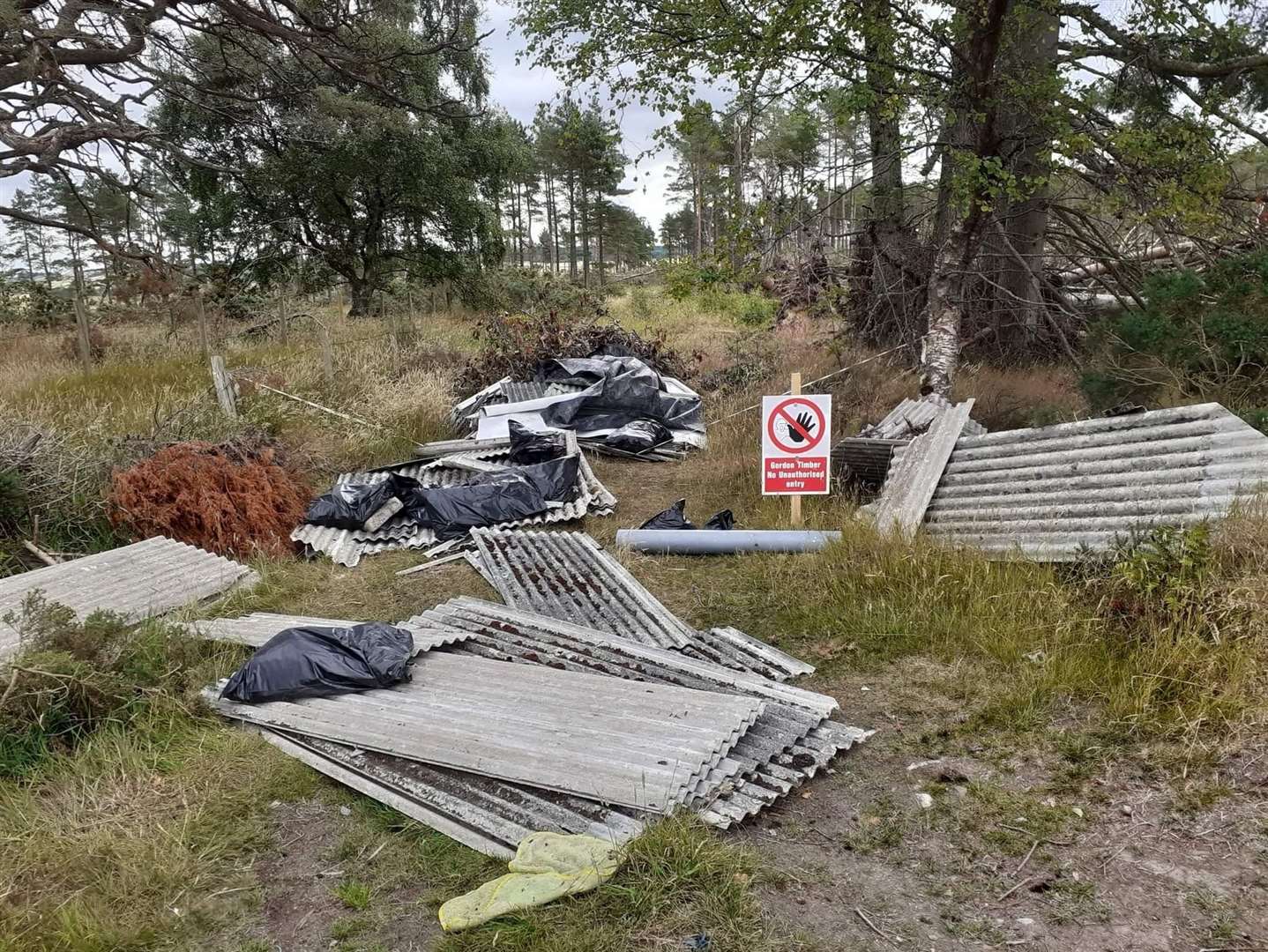 The waste left at Balbithan woods included roofing sheets and black bags.