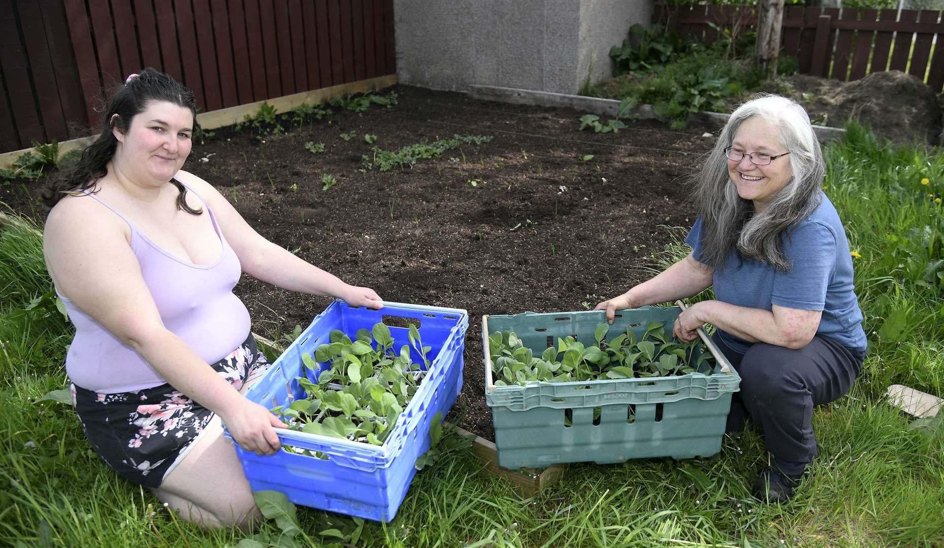 Julie-Ann Henderson (right) is running a project helping people use their gardens to grow their own produce - Steph Wilson is one of the volunteers. Picture: Becky Saunderson.
