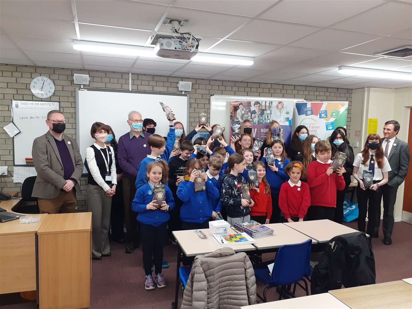 Richard Thomson MP (left) with pupils and teachers from Bridge of Don Academy, Scotstown Primary School and Braehead Primary School with members of Aberdeen for a Fairer World.