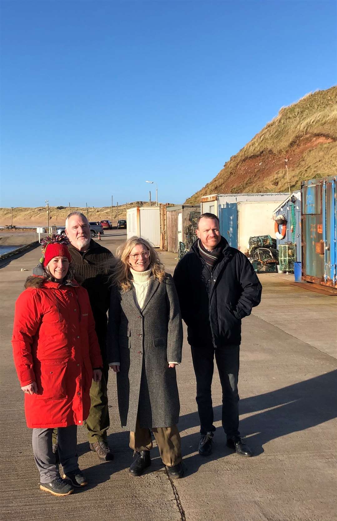 Directors of the Port Erroll Harbour Trust Paula Webber and Robert Lister with MSP Gillian Martin and Councillor Stephen Smith.