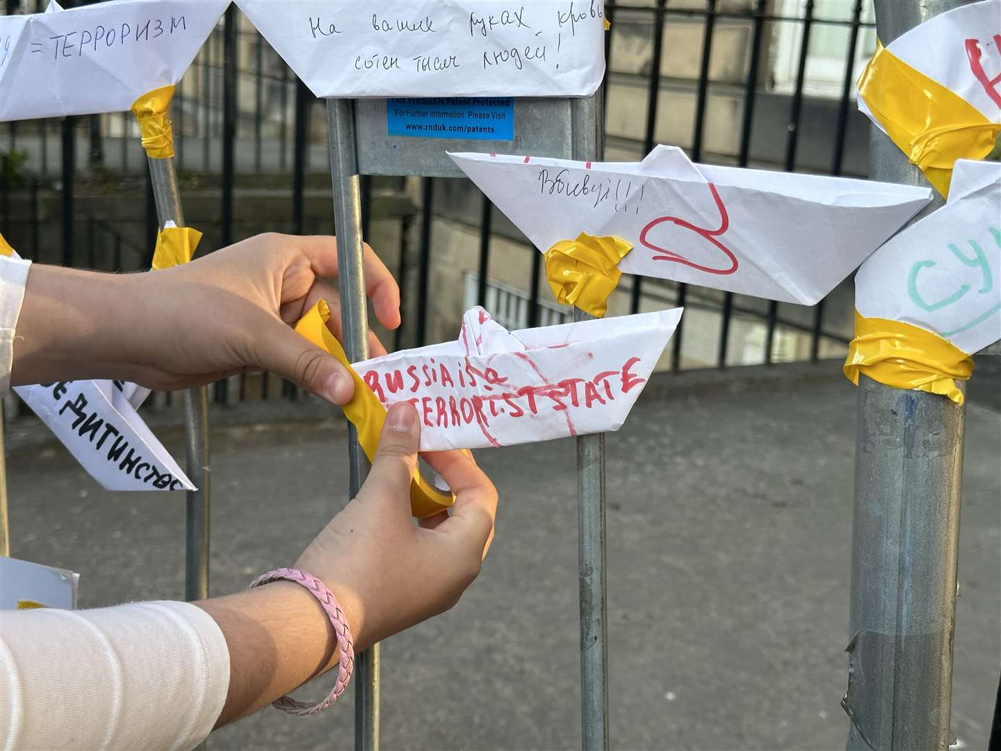 Protesters leave paper boats with messages on them at the Russian consulate in Edinburgh (Dan Barker/PA)