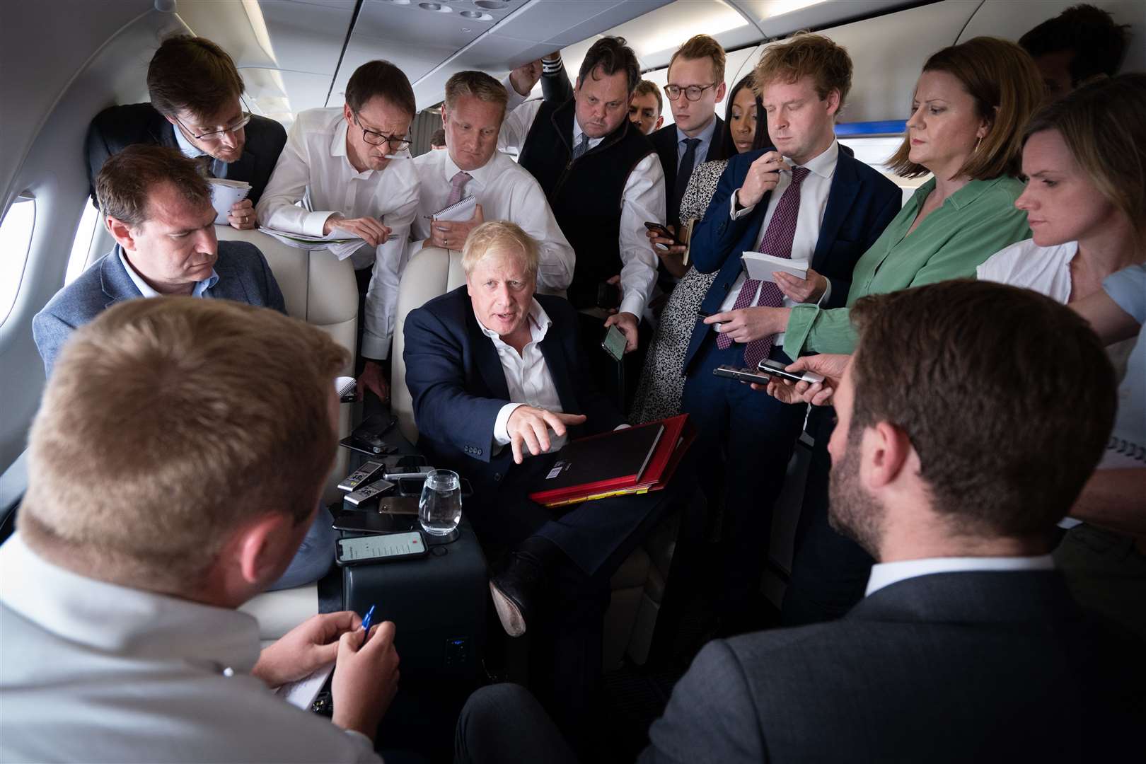 Boris Johnson talks to journalists on his flight to the Nato summit (Stefan Rousseau/PA)