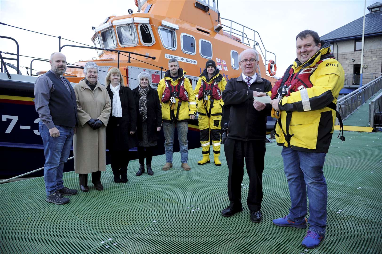 Buckie RNLI lifeboat coxswain Alan Robertson (right) accepts a cheque for £1300 from South and West Church events committee member Gordon Pirie. Joining them are (from left) Rev Wes Brandon, Janice Dawson and Mary Stephen (all South and West Church) as well as lifeboat crew Brian Forbes and Jordan Campbell. Picture: Eric Cormack