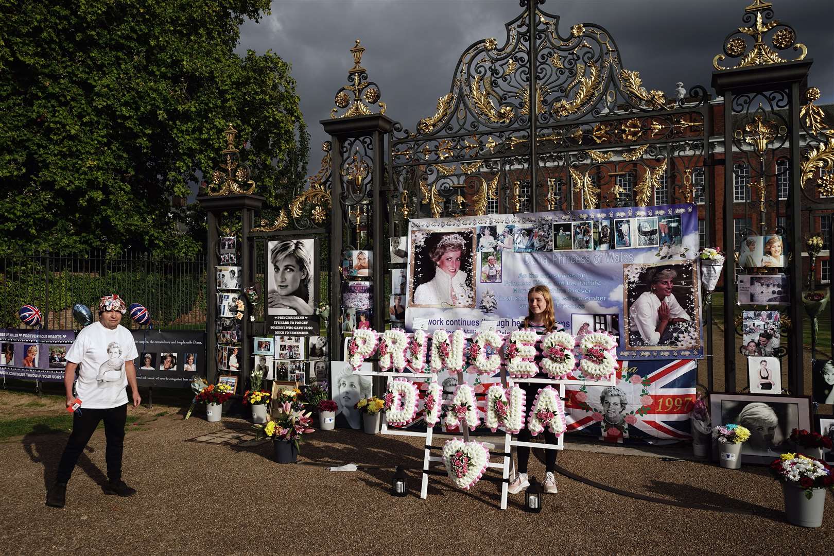 Flowers are placed at the gates outside Kensington Palace on the 25th anniversary of Diana’s death (Aaron Chown/PA)
