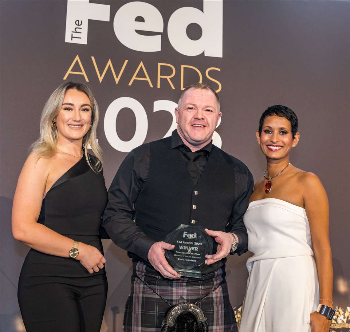 David Robertson is congratulated by Claire McDonald (left), Retail Channel Manager from Menzies Distribution, which sponsored the award and Naga Munchetty, who hosted the ceremony.