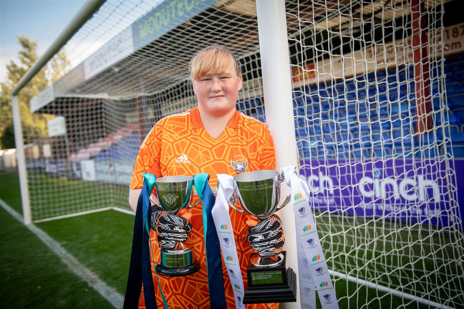 Buckie Ladies goalkeeper Sophia Golebiewski with the league and League Cup trophies. Picture: Callum Mackay