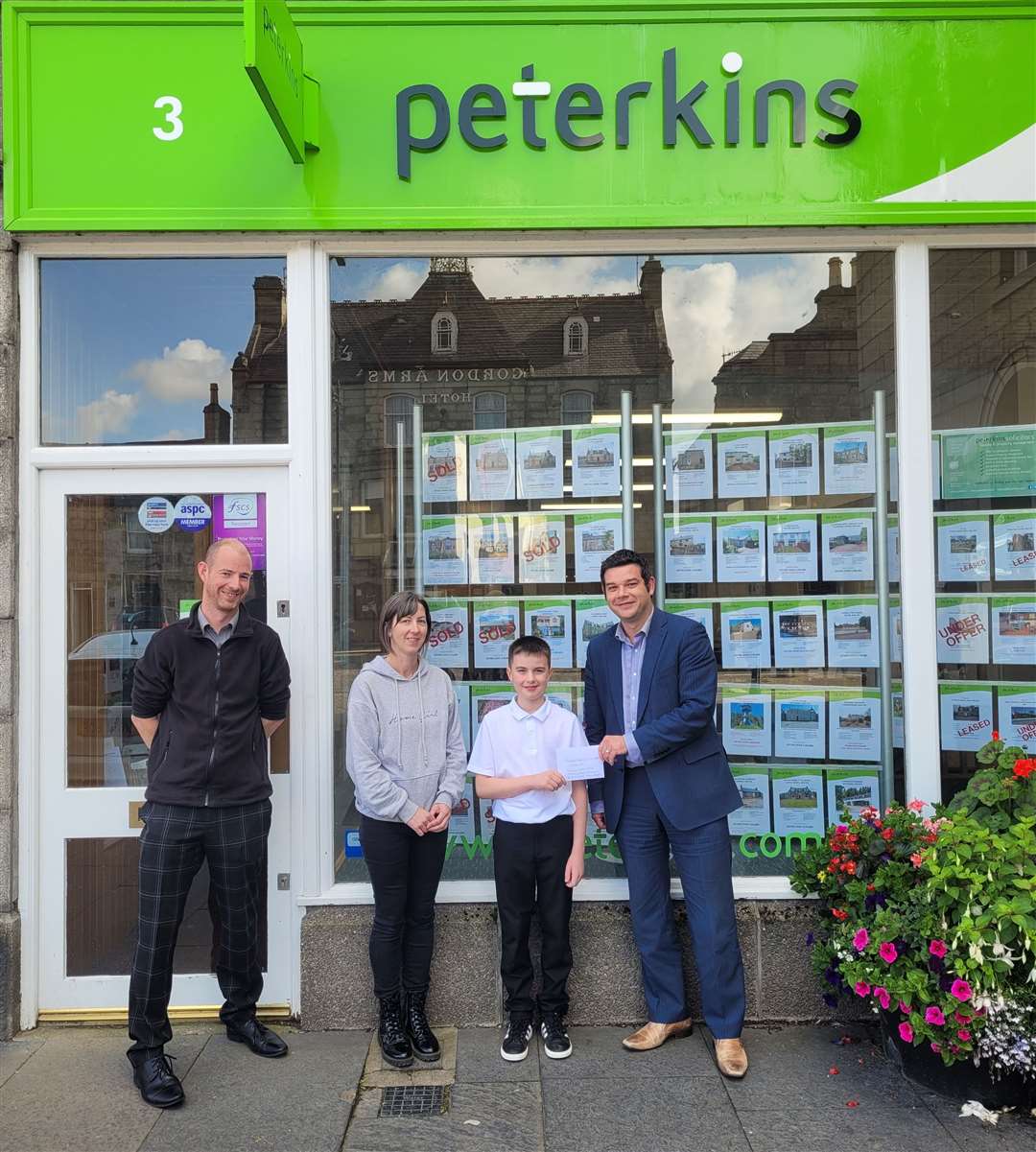 Martin Kingdon, leasing manager, and Jamie Craig, partner of Peterkins, and between them Jenny Milne and her son Aaron who won the younger class.