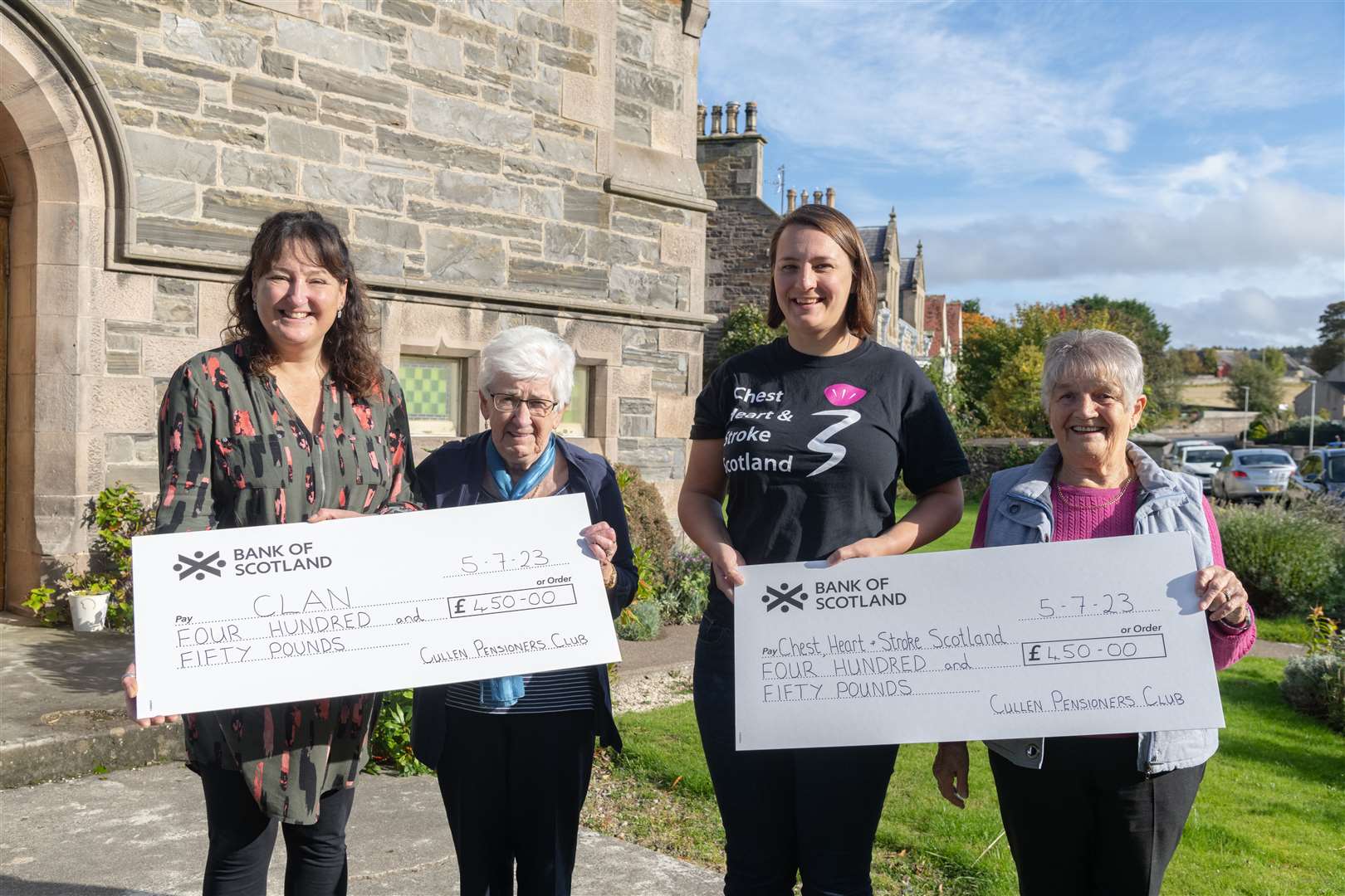 Cullen Pensioners Club president Vera Reid (right) and vice-president Morag Mair (second left) present cheques for £450 to Anne Magarin (CHSS) and Julie Ferguson (Clan). Picture: Beth Taylor