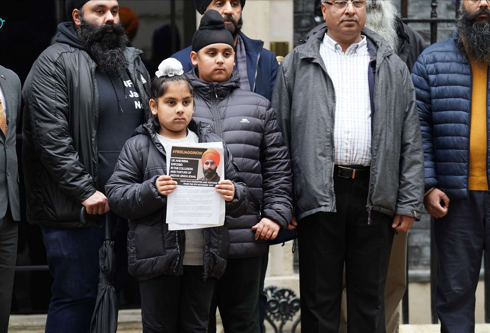Members of the Free Jaggi Now Campaign hand in a petition to mark five years since the arrest of Jagtar Singh Johal (James Manning/PA)