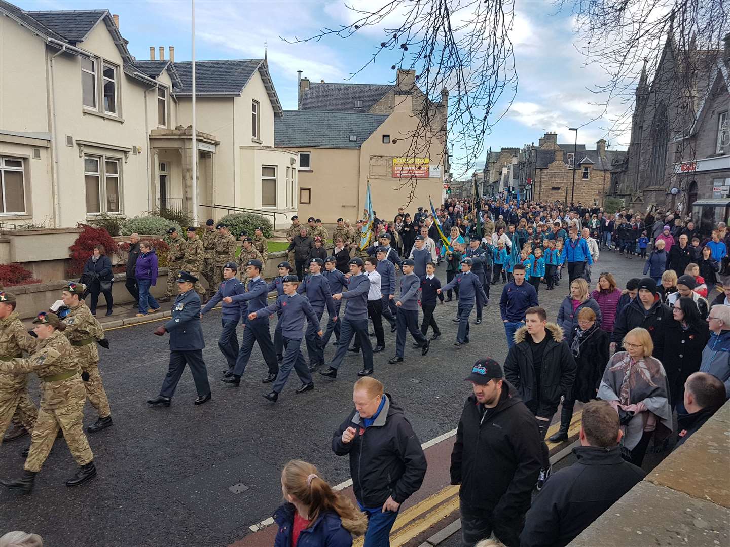 Local Air Cadets leading younger groups down Bridge Street.