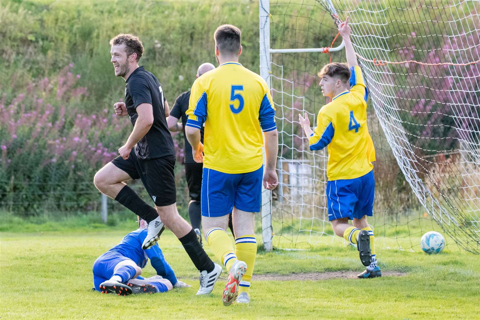 Craigellachie's James McPherson wheels away to celebrate after opening the scoring on the evening...Picture: Daniel Forsyth..
