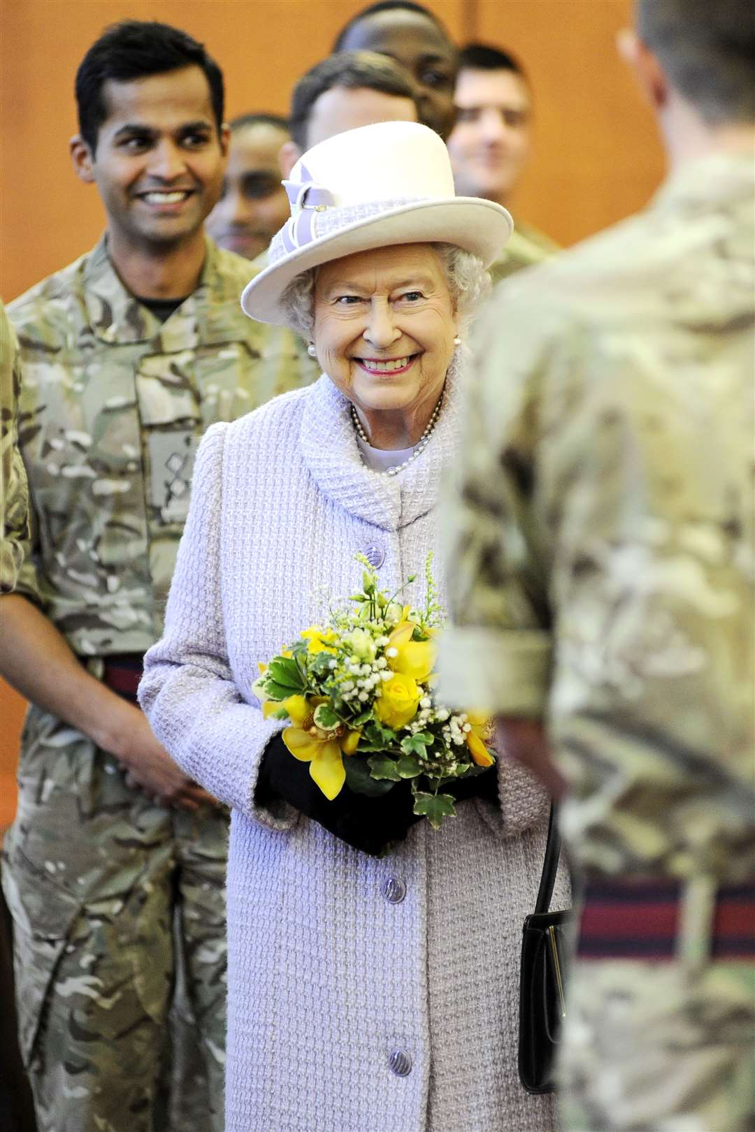 All smiles as she meets personnel from Kinloss Barracks in 2014.