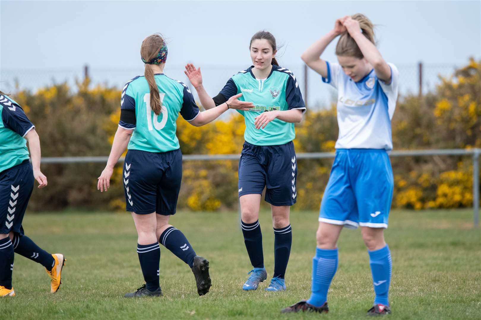 Buckie Ladies' Catie Carter (centre), pictured here scoring against Sutherland, was on the scoresheet again. Picture: Daniel Forsyth