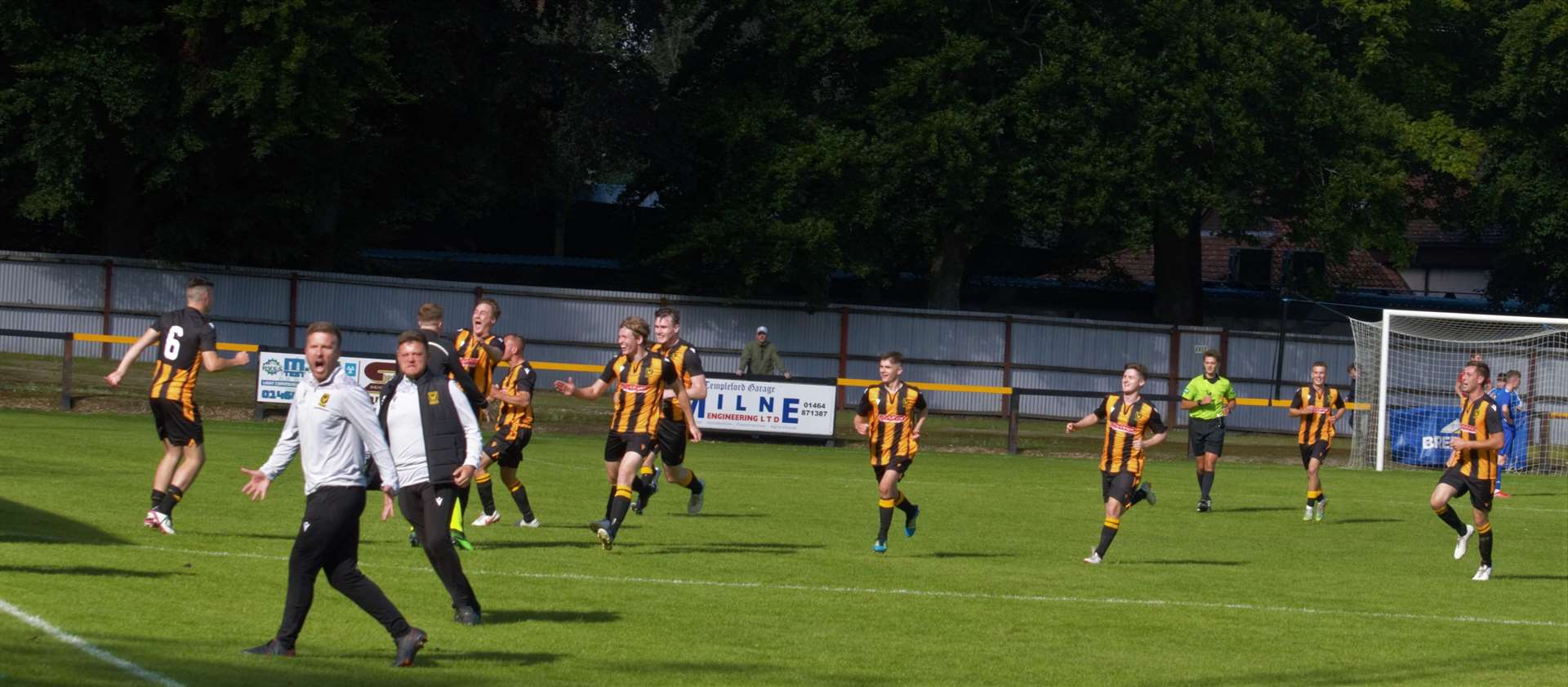 Huntly boss Allan Hale and his assistant Stefan Laird celebrate the late winner. Photo: Derek Lowe.
