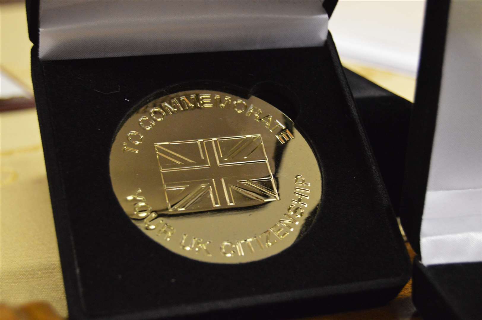 The commemorative medal presented to the new UK citizens.