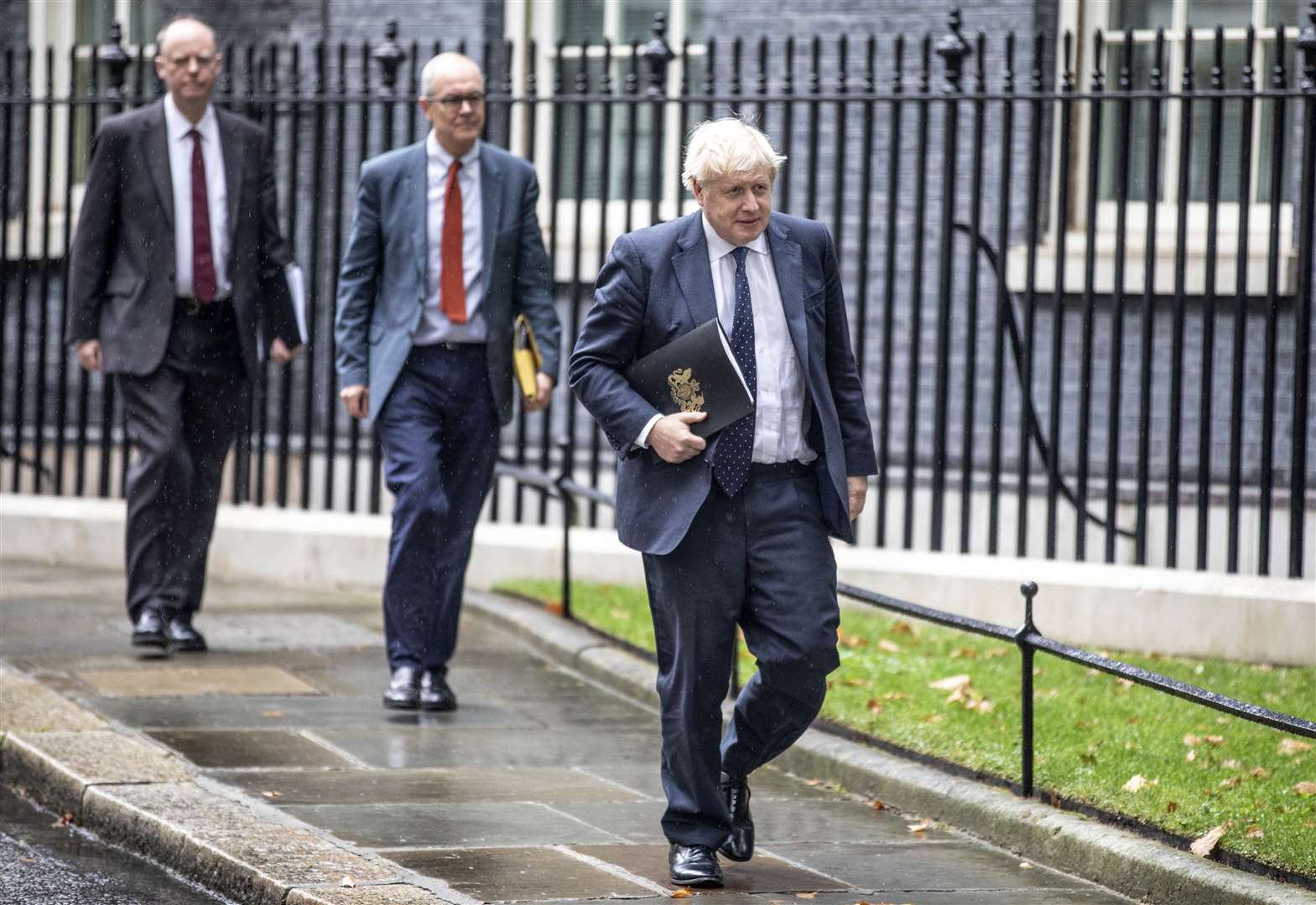 Boris Johnson leads Sir Patrick Vallance and Professor Chris Whitty to the Downing Street news conference (Richard Pohle/The Times/PA)