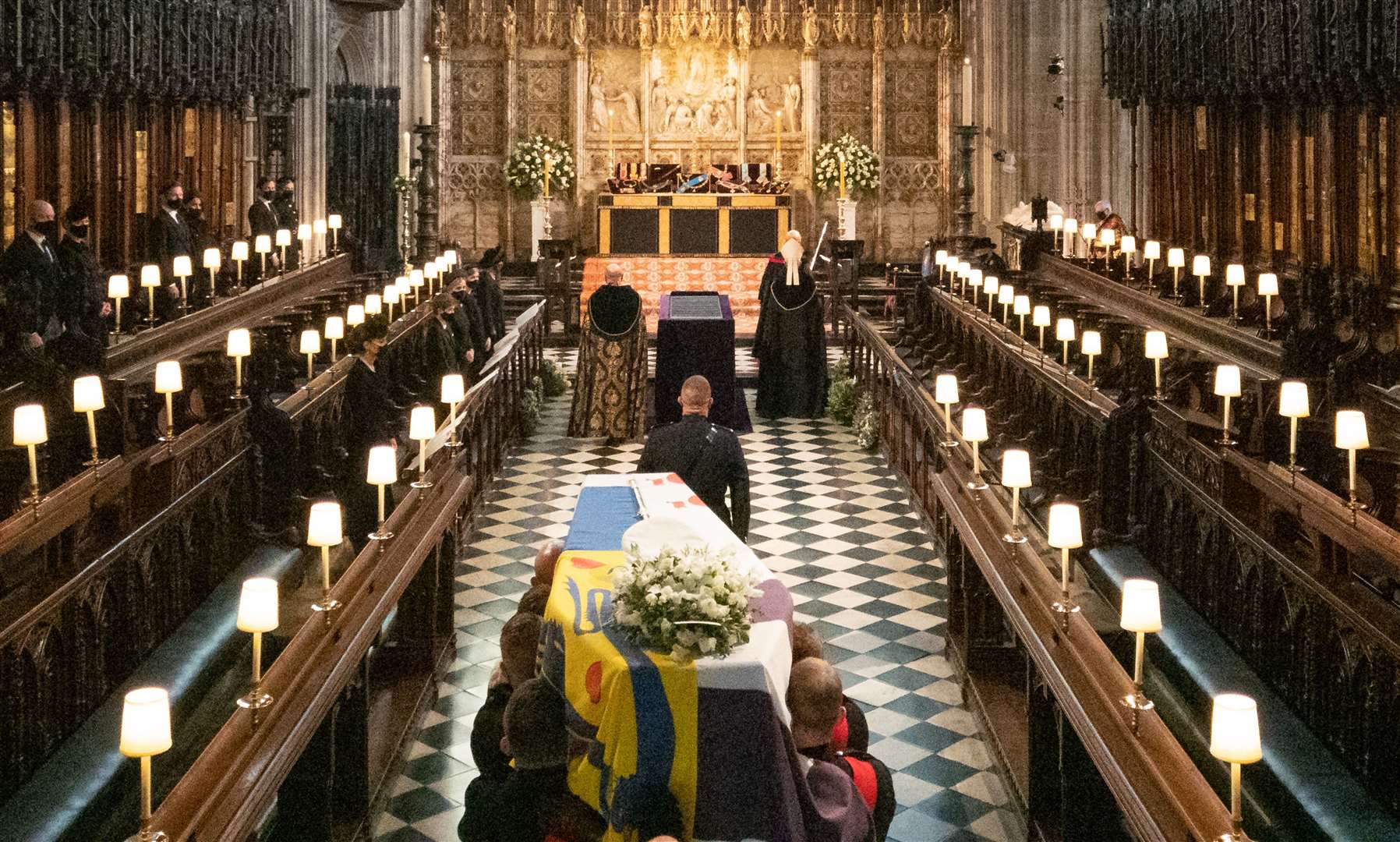 The coffin of the Duke of Edinburgh is carried into The Quire during his funeral service at St George’s Chapel (Barnaby Fowler/PA)