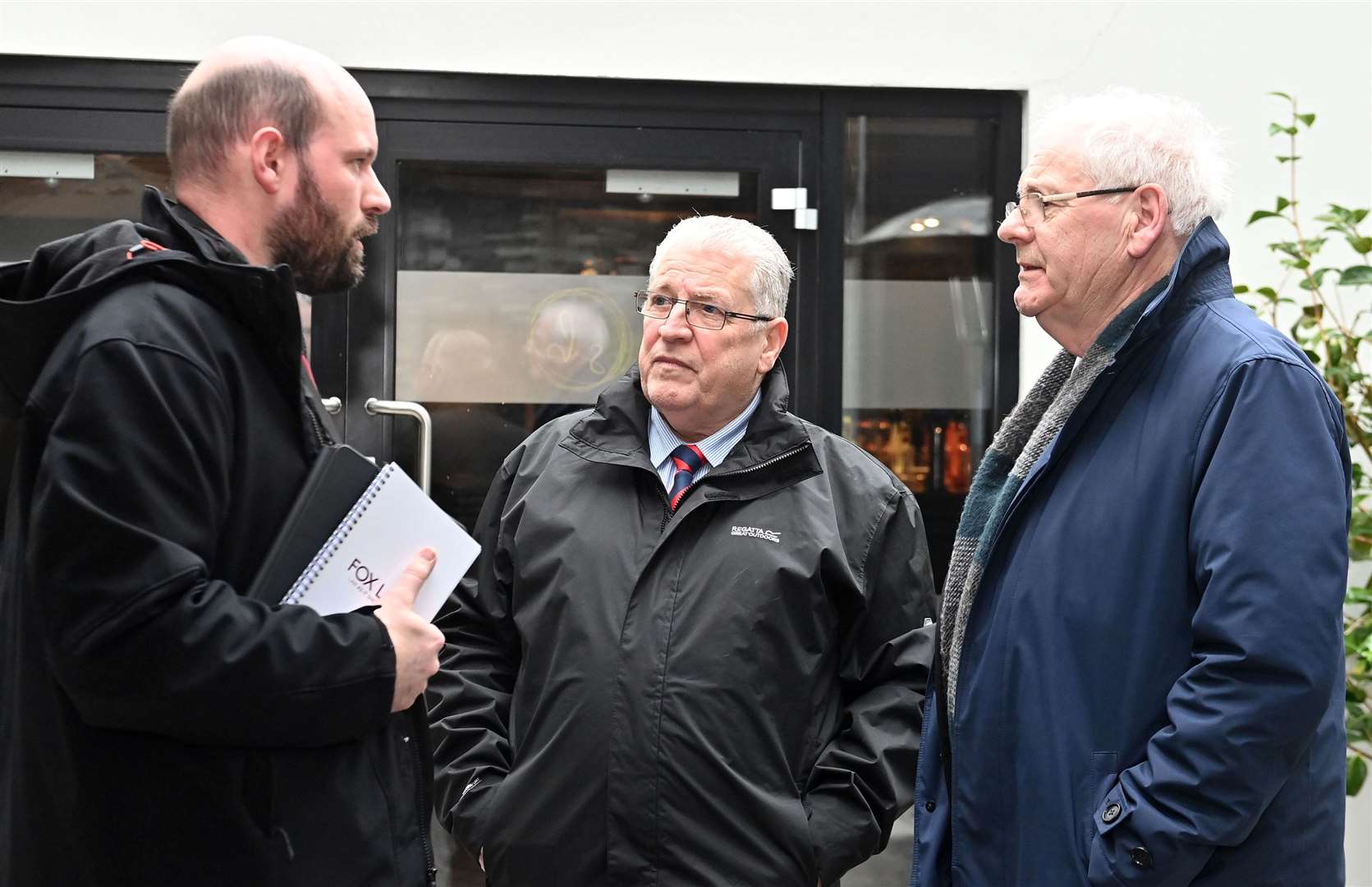 Omagh bomb campaigners Michael Gallagher (right) and Stanley McCombe speak to Omagh bomb solicitor John Fox (left) (Oliver McVeigh/PA)