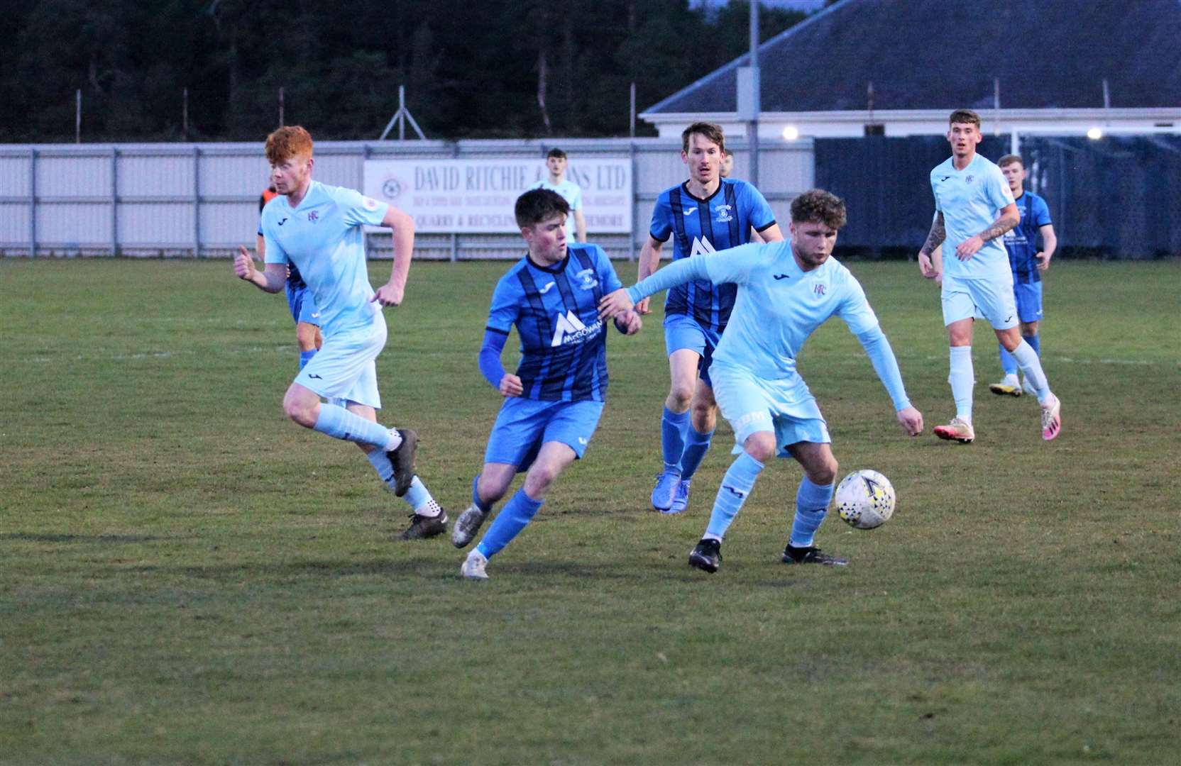 Michael Ironside on the ball, holding off Strathspey Thistle's Owen Paterson with goalscorer Matty Tough (left) looking on. Picture: Frances Porter