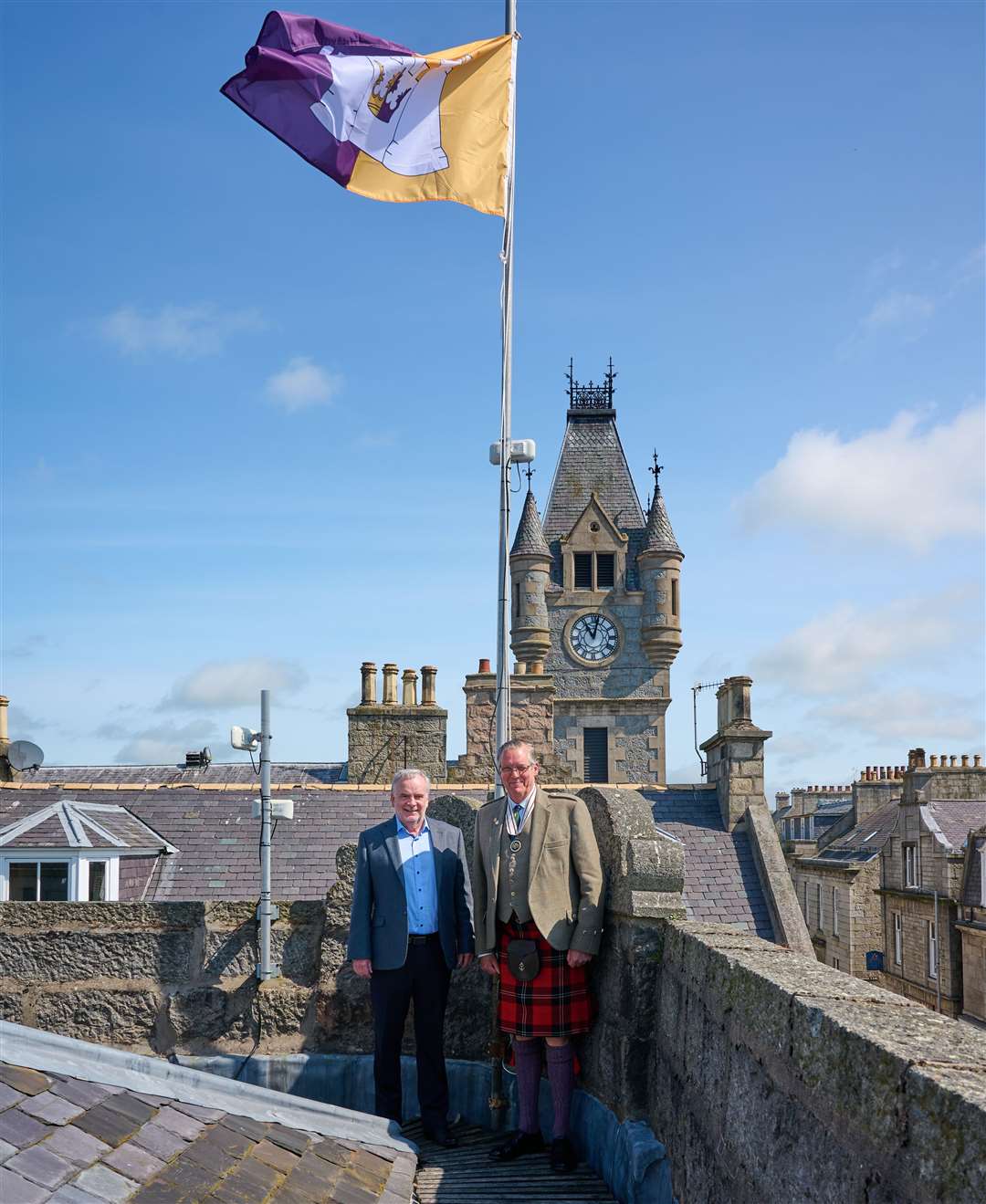 Huntly Community Council chairman Tony Gill and Deputy Lord-Lieutenant Grenville Irvine-Fortescue raise the flag...Picture: Dave Simpson
