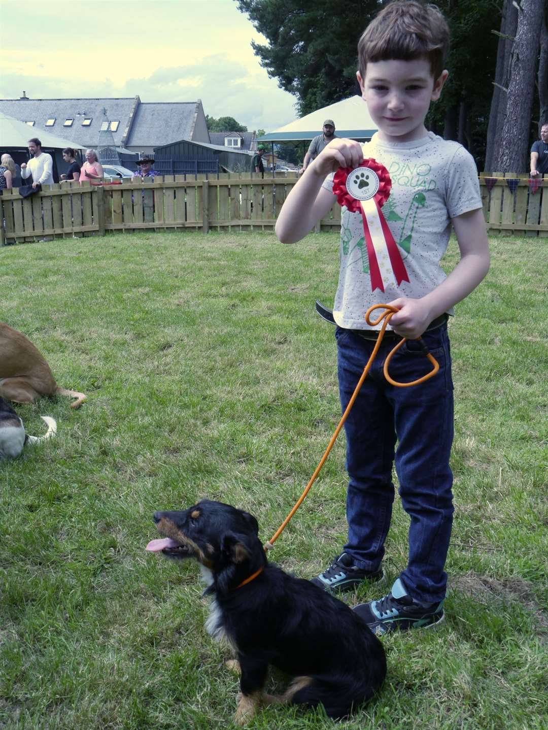 Rascal, a nine-month-old Jack Russell pictured with Sandy Strachen from Gartly, won the child's best friend category.