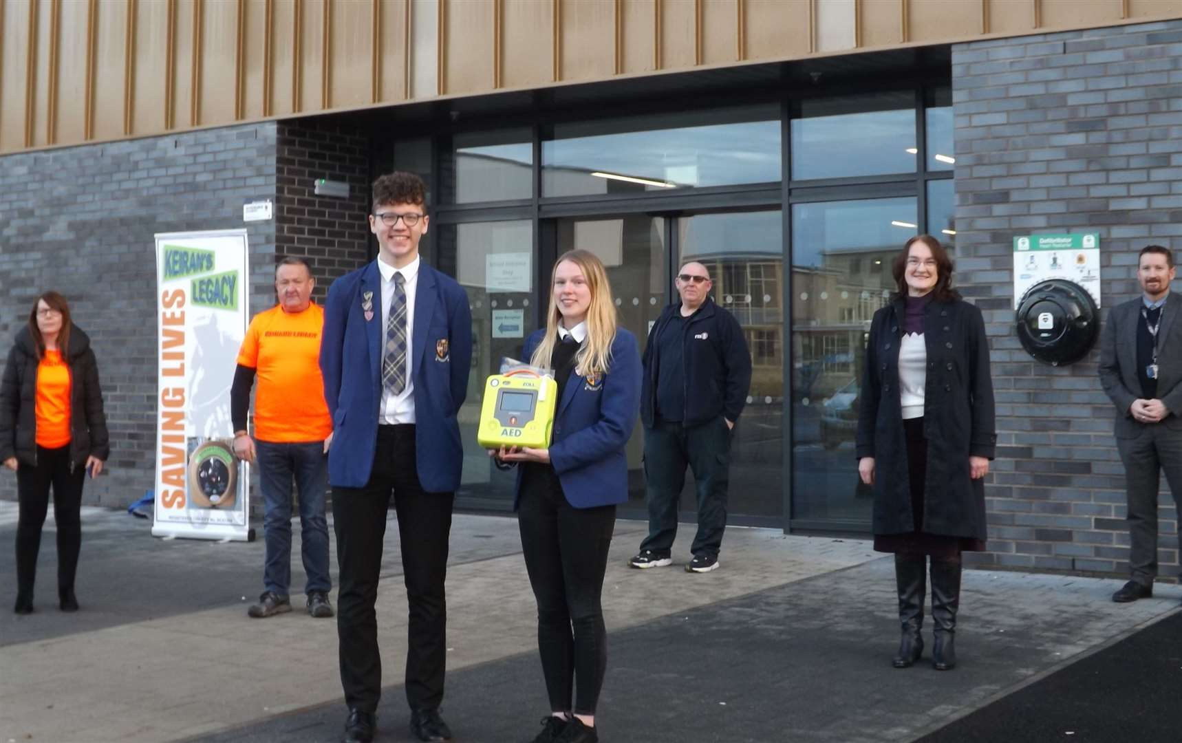 Pupils Christopher Forbes and Caitlin Dick were joined by representatives of the groups involved for the installation of a new defibrillator at the Community Campus.