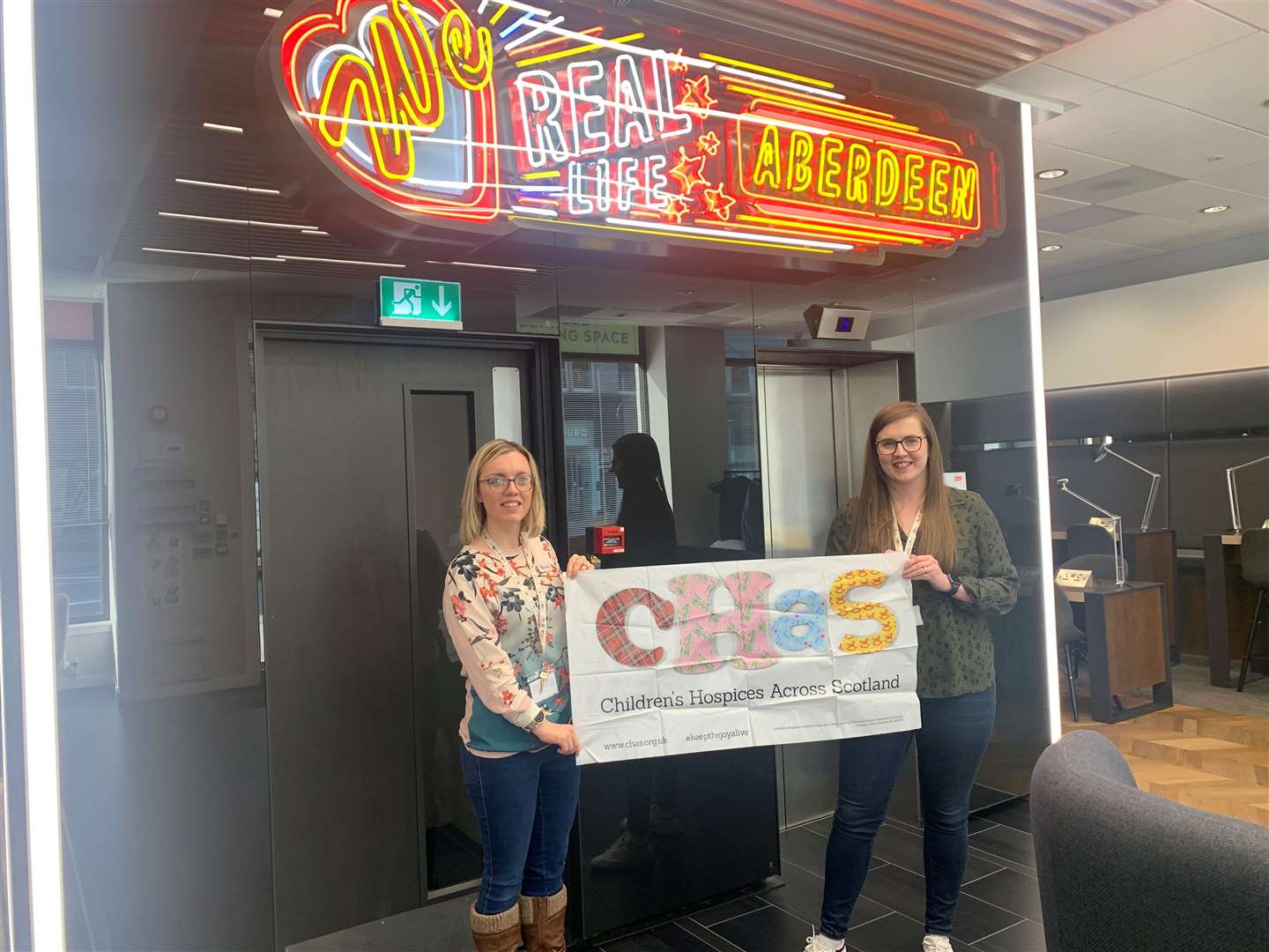 CHAS Volunteering Development Manager Fiona Harvey and Senior Community Fundraiser Emma Gartland at the opening of the new Aberdeen CHAS office.