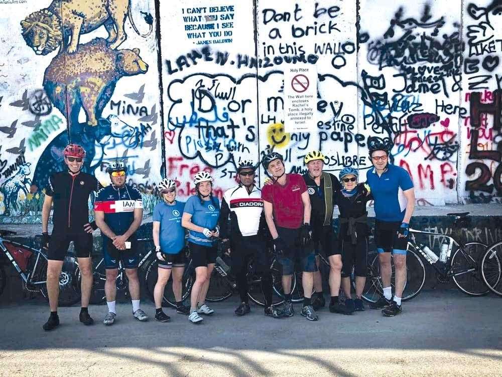 Ray Aiken (fourth from the right) with his charity cycle group in Palestine. The group cycled along The Separation Wall, which restricts the freedom of movement for Palestinians.
