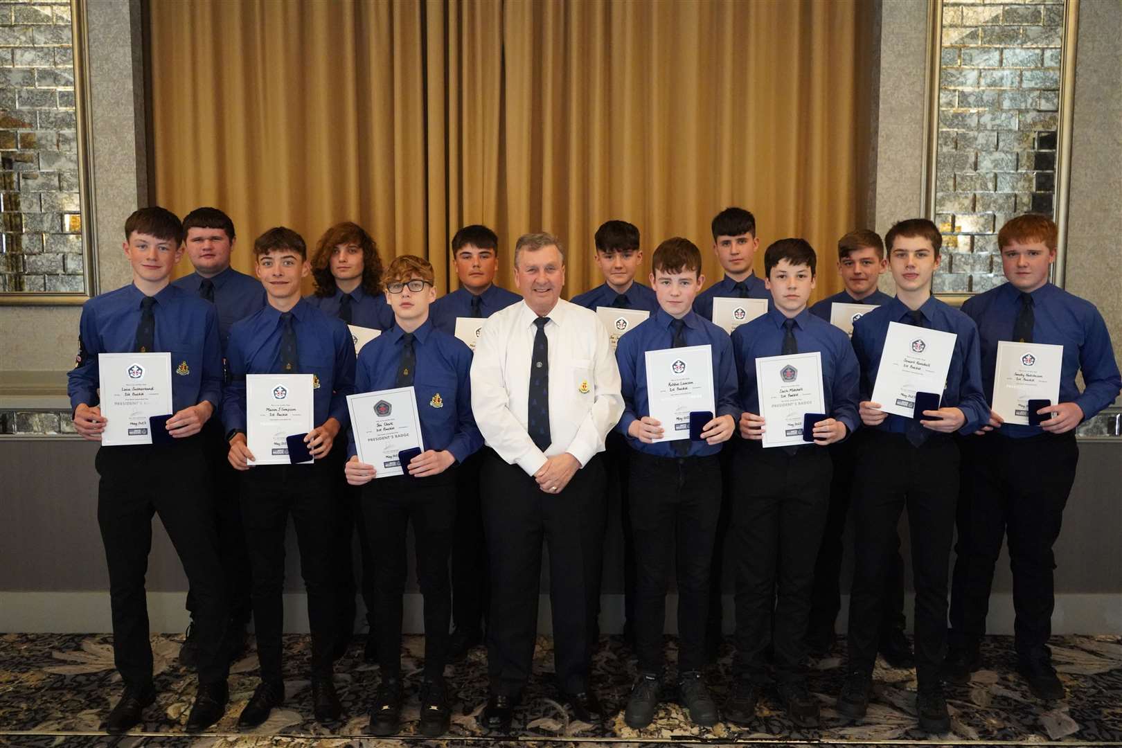 The President Badge boys proudly show off their awards, joined by H Murray Campbell. Picture: Buckie BB