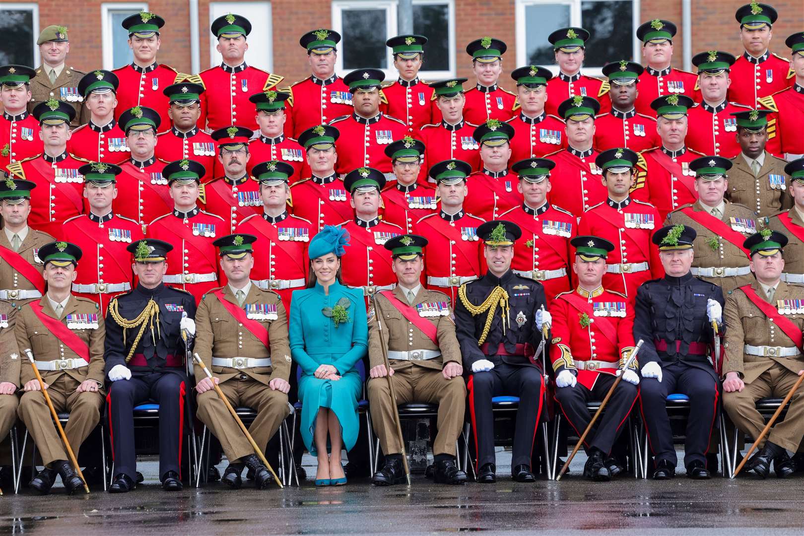 The Prince and Princess of Wales sit for a group photo at Mons Barracks (Chris Jackson/PA)