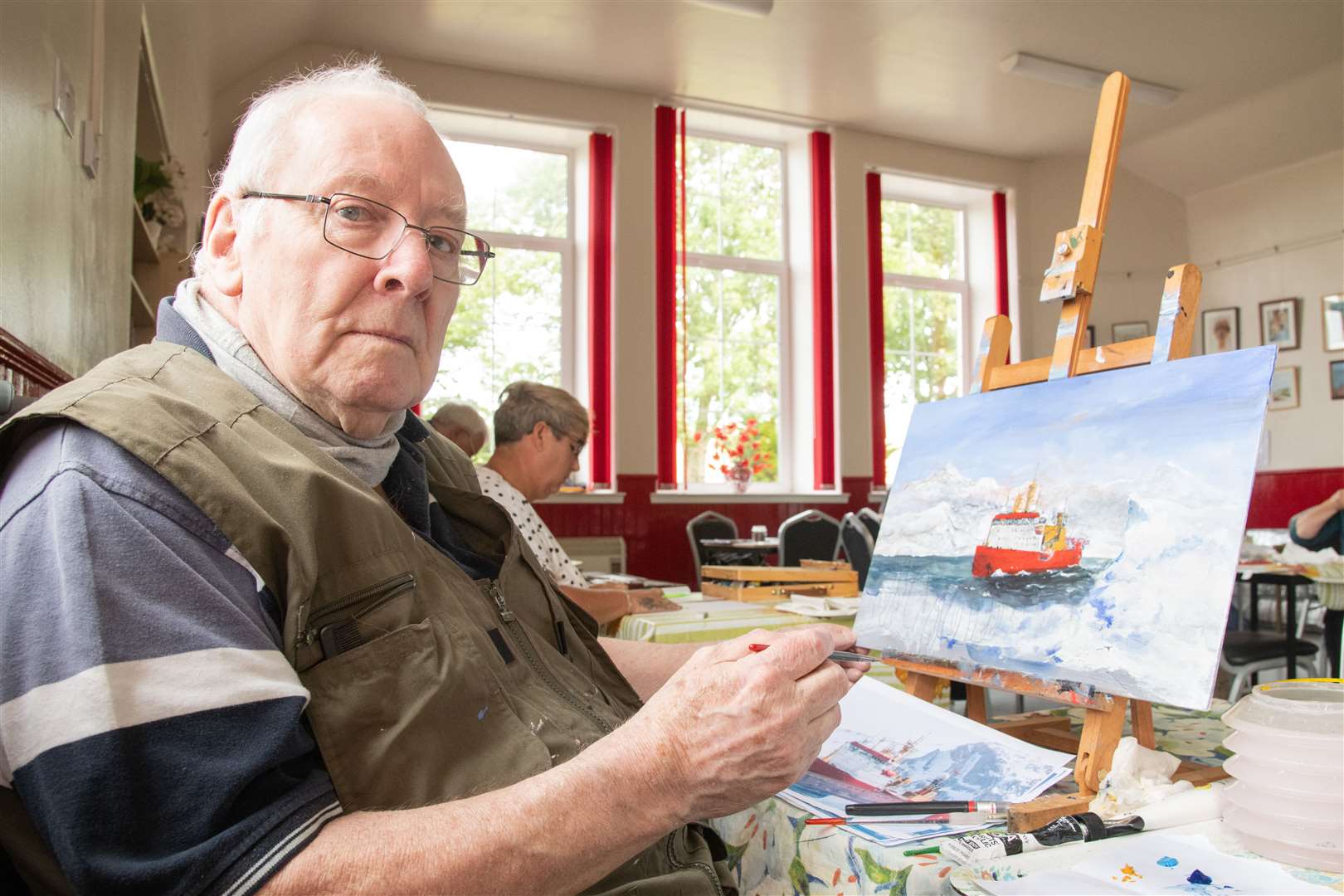 Terry Gill puts the finishing touches to one of his pieces for the exhibition. Picture: Daniel Forsyth
