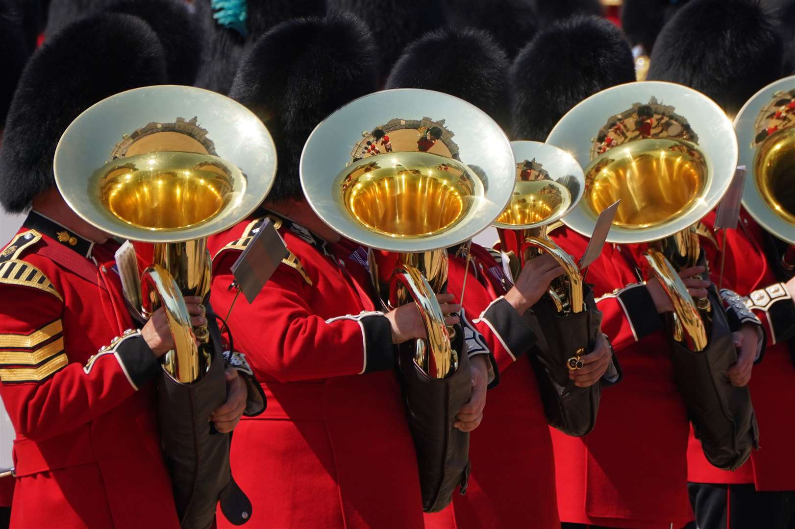 Sun gleams on the brass section of the military band (Jonathan Brady/PA)