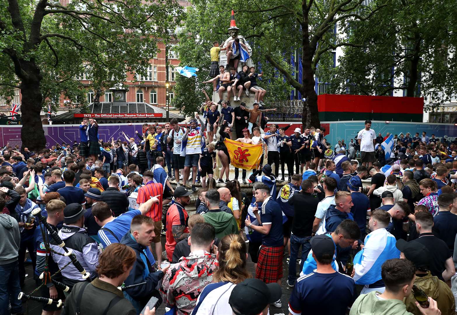 Fans climbed on to the fountain of William Shakespeare in Leicester Square (Kieran Cleeves/PA)