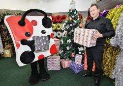 Spotty Bag Shop owner Des Cheyne at the giving tree.