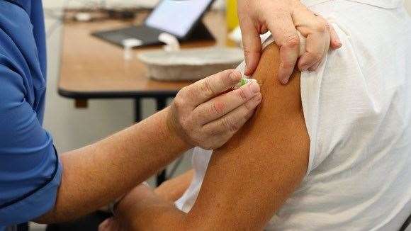 Those eligible for Covid-19 and flu vaccinations are being urged to book an appointment.